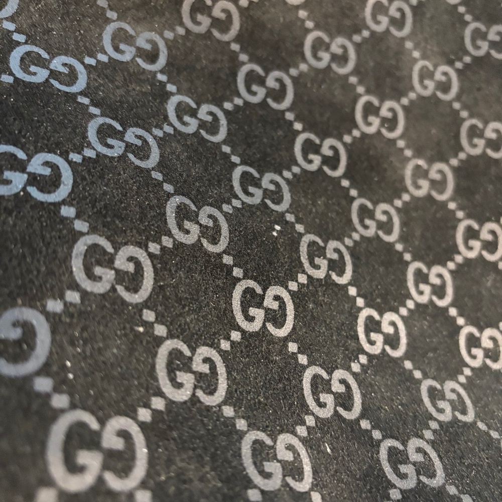 Gucci black suede with embossed logo